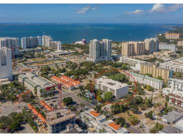 Aerial view showing a building's location in a dense urban area near the coast at 332 Cocoanut Ave # 503, Sarasota, FL 34236