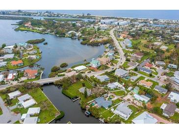 Property located on the water, near other homes and waterways at 612 Albee W Rd, Nokomis, FL 34275