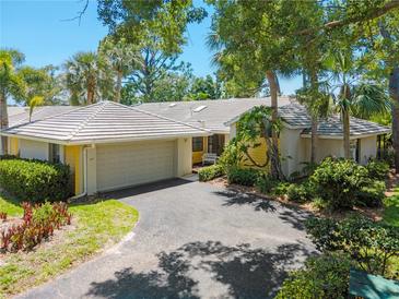 Single-story home with attached garage and lush landscaping at 227 Southampton Dr # 289, Venice, FL 34293