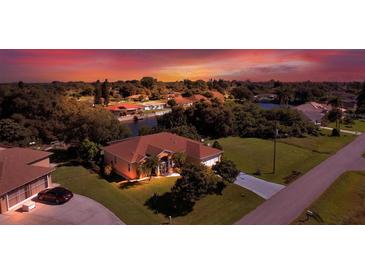 Attractive single-Gathering home on a canal with a beautiful sunset at 12004 Sarto Ln, North Port, FL 34287
