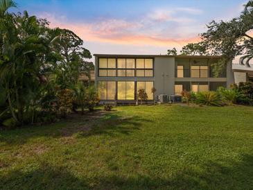 Two-story condo with a spacious backyard and lush landscaping at 886 Bird Bay Way # 206, Venice, FL 34285