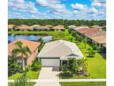 Single-Gathering home with lake and community view at 20318 Minuet Pl, Venice, FL 34293