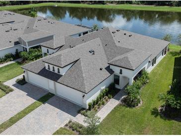 Luxury house with lake view and two-car garage at 12586 Oak Hill Way, Parrish, FL 34219