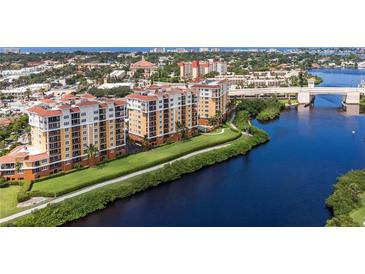 Beautiful aerial view of waterfront condos featuring lush landscaping and convenient bridge access at 147 Tampa E Ave # 202, Venice, FL 34285