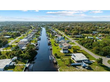 Aerial view showcasing the community's waterfront location and canals at 3358 Yukon Dr, Port Charlotte, FL 33948