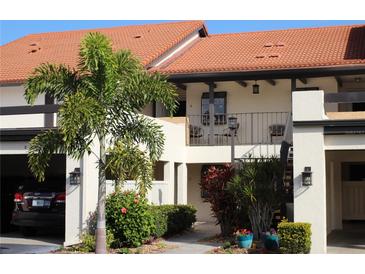 Two-story townhome with balcony and landscaping at 766 Avenida Estancia # 196, Venice, FL 34292