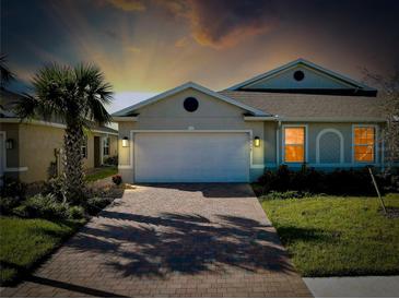 Attractive one-story home with a two-car garage and landscaped lawn at 16058 Bridle Ridge St, Port Charlotte, FL 33953