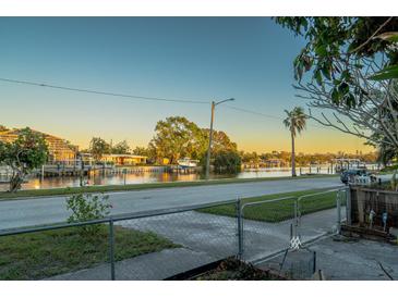 Scenic waterfront view with boats and homes at 3911 Sunrise S Dr, St Petersburg, FL 33705