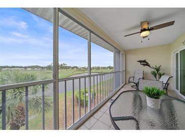 Spacious lanai overlooking a golf course and water features, perfect for relaxing at 404 Cerromar N Cir # 315, Venice, FL 34293