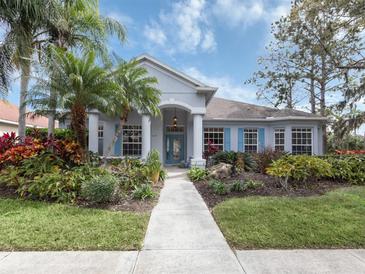 Beautiful one-story home with landscaped yard and walkway at 819 Shadow Bay Way, Osprey, FL 34229