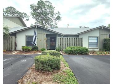 Inviting exterior of a single-story home with a landscaped yard and private driveway at 145 Jose Gaspar Dr # 145, Englewood, FL 34223