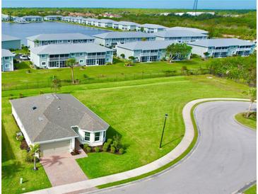 Aerial view of single-Gathering home with surrounding community at 3648 Pebble Ter, Punta Gorda, FL 33980