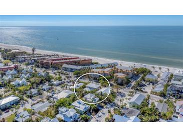 Aerial view of a house near the beach, surrounded by other homes at 6405 Gulf Dr, Holmes Beach, FL 34217