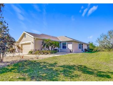 Single-story home with a two-car garage and well-manicured lawn at 4334 Lenox Blvd, Venice, FL 34293