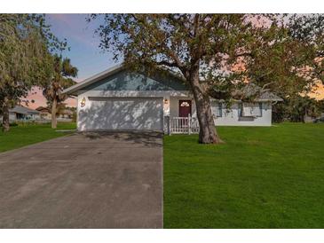 Ranch-style home with a spacious yard and driveway at 2281 Mars Rd, Venice, FL 34293