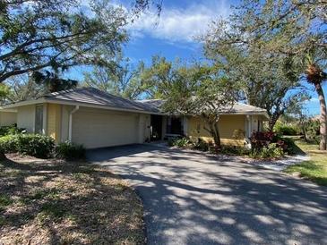 Charming single-story home featuring an attached two-car garage and mature landscaping in a well-maintained community at 263 Southampton Dr # 301, Venice, FL 34293