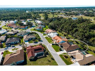 Aerial view showing the property's location, landscaping, and proximity to green spaces at 1678 Quail Lake Dr, Venice, FL 34293