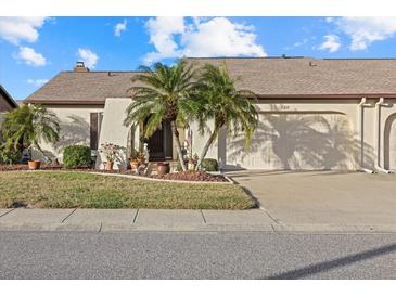 Attractive single-story home with palm trees and well-maintained landscaping at 508 Foxwood Blvd, Englewood, FL 34223