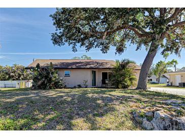 Charming single-story home with a mature tree in the front yard at 3187 Galiot Rd, Venice, FL 34293