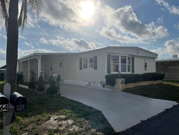 Charming single-story home featuring a covered carport and well-maintained landscaping for enhanced curb appeal at 863 Baveno Dr, Venice, FL 34285