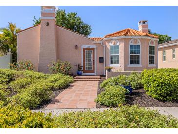 Charming home featuring a tile roof, stucco exterior, and landscaped front yard at 321 Pedro St, Venice, FL 34285