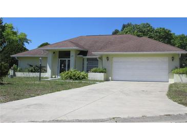 Charming single-story home with a two-car garage and well-maintained landscaping at 157 Algiers Dr, Venice, FL 34293