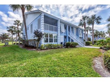 Charming two-story condo with lush landscaping and a beautiful lawn at 454 Cerromar Rd # 172, Venice, FL 34293