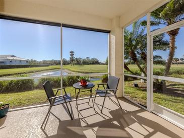 Relax on the screened lanai with views of the golf course and beautiful landscaping at 2602 Ravinia Cir # 2602, Venice, FL 34292