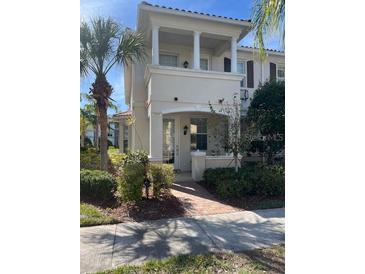 Charming two-story home with well-manicured landscaping and a cozy front porch at 1569 Napoli W Dr, Sarasota, FL 34232