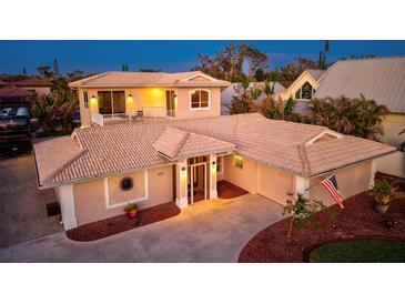 Charming single-Gathering home with a tile roof, well-maintained landscaping, and an inviting entranceway at 632 Valencia Rd, Venice, FL 34285