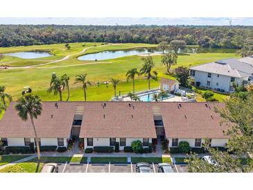 Scenic condo community with pool and golf course views at 1027 Capri Isles Blvd # 22, Venice, FL 34292