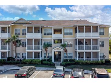 Condo building featuring multiple units with screened patios, well-maintained landscaping, and convenient parking at 4802 51St W St # 1816, Bradenton, FL 34210