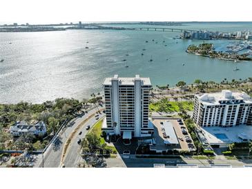 Stunning aerial view of waterfront condo with bay views and city skyline at 770 S Palm Ave # 404, Sarasota, FL 34236