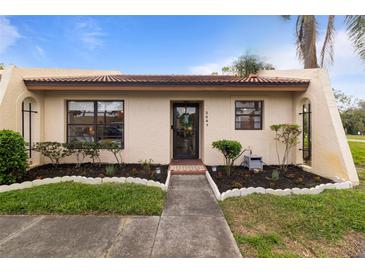 Charming single-story home with well-maintained landscaping and inviting walkway leading to the front door at 3641 Longmeadow # 33, Sarasota, FL 34235