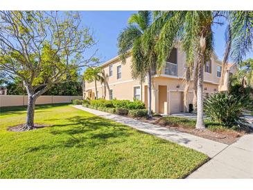 Charming townhome with lush landscaping, mature trees, and a private front porch at 3691 Parkridge Cir # 201, Sarasota, FL 34243