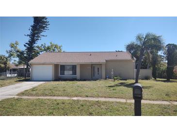 Charming single-story home with a well-maintained lawn and a mailbox in front at 3224 Mount Hope St, North Port, FL 34287