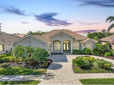 Charming single-story home with meticulously landscaped front yard and inviting curb appeal at 4228 Corso Venetia Blvd, Venice, FL 34293