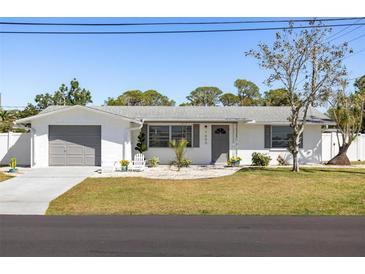 Charming single-story home with a well-manicured front yard and inviting curb appeal at 1600 Maryknoll Rd, Englewood, FL 34223