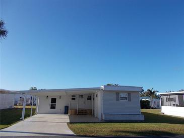 Charming single-story home with a covered carport and well-maintained lawn, perfect for relaxing outdoor living at 443 Spruce Ave, Venice, FL 34285