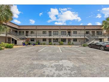 Multi-unit condo building with on-site parking spaces for residents and guests alike at 1258 Barbara Dr # 105, Venice, FL 34285