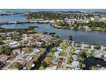 Beautiful aerial view of the waterfront property, showcasing canal access and proximity to the bay and Gulf of Mexico at 504 Buena Vista Dr, Nokomis, FL 34275