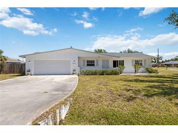 Charming single-story home with a well-maintained lawn and attached two-car garage at 4531 Crystal Rd, Venice, FL 34293