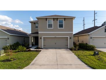 Charming two-story home with a well-manicured lawn and inviting curb appeal at 4907 Wedgeleaf Way, Palmetto, FL 34221