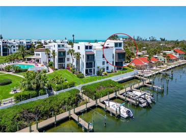 Beautiful waterfront home featuring a marina, lush landscaping, and community pool at 2955 N Beach Rd # A422, Englewood, FL 34223