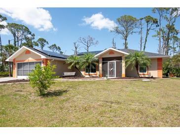 Charming single-story home features an attached garage, mature landscaping, and front bench at 14124 Kewanee Ln, Port Charlotte, FL 33981