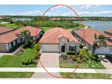 Well-maintained home with tile roof, manicured lawn, and attractive landscaping in a desirable community at 10618 Corkwood Ct, Venice, FL 34293