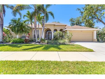 Stunning single-Gathering home showcasing lush landscaping and a charming exterior at 622 Pine Ranch East Rd, Osprey, FL 34229