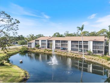 Beautiful waterfront condo complex features a lake with fountain and screened lanais at 1190 Bird Bay Way # 309, Venice, FL 34285
