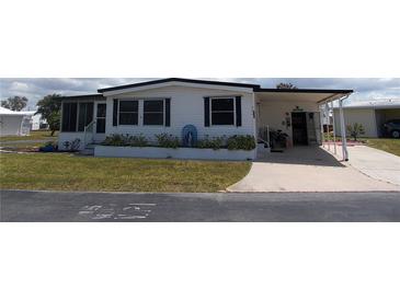 Charming single-story home with a well-maintained lawn and an inviting entrance in a beautiful neighborhood at 542 Walnut Cir, Venice, FL 34285