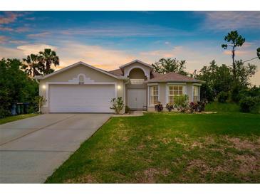 Charming single-Gathering home with a well-manicured lawn and a two-car garage, perfect for suburban living at 2267 Yalta Ter, North Port, FL 34286